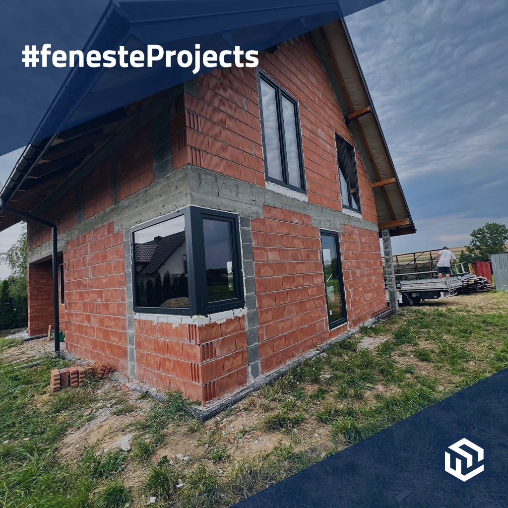 Single-family house with black windows on the outskirts of the city projects window-profiles pvc rehau synego 